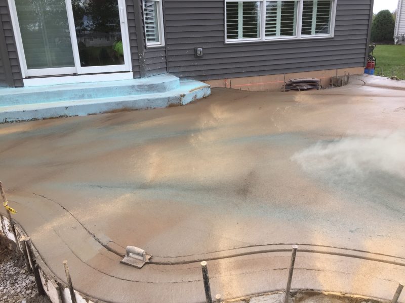 Stamped Concrete patio with Exposed Aggregate Border Concrete