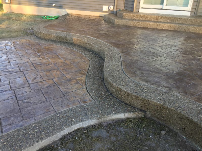 Stamped Concrete patio with Exposed Aggregate Border Concrete