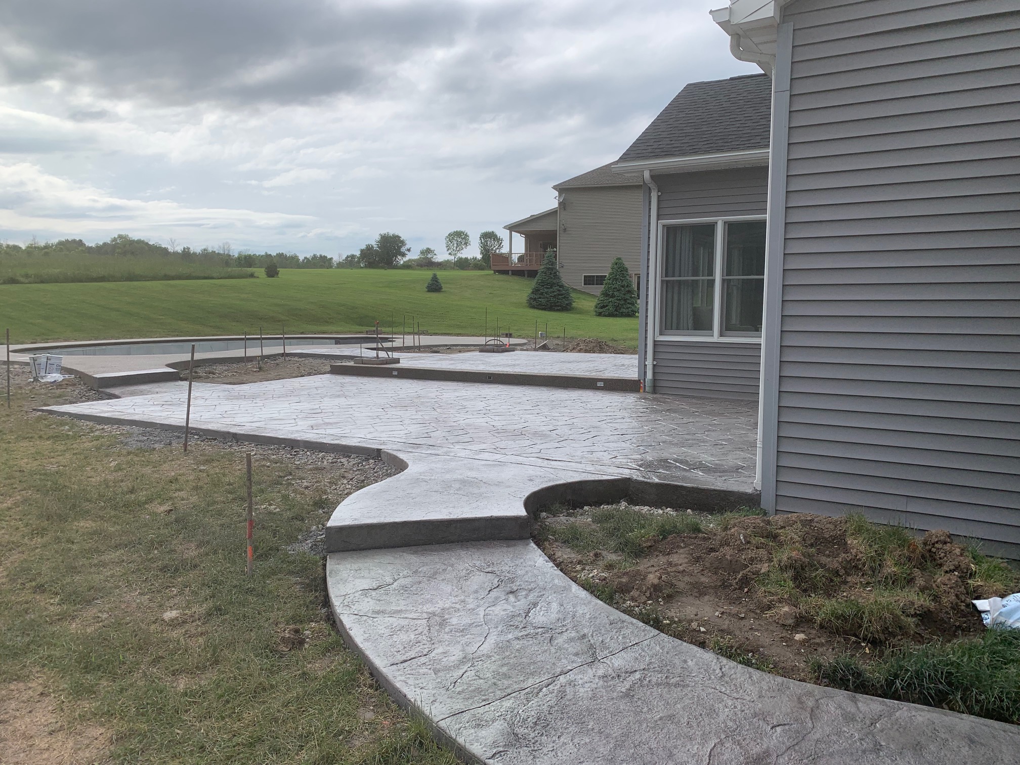 Stamped Patio, Pool Surround, Sidewalk, Pillars & Overhang